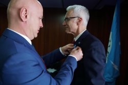 Commander-in-Chief of the Police Jaroslaw Szymczyk awards the Secretary General of Interpol Jurgen Stock with a commemorative badge